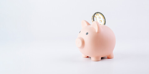Obraz premium Save currency bitcoin. Pink pig bank with golden bit coin money BTC on white background. Save money investment and business finance.
