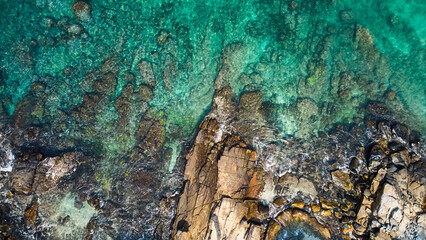 Aerial view of an emerald green sea and big foaming waves. Dikwella beach.