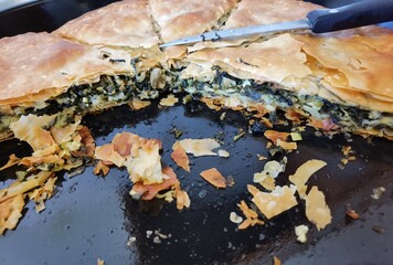 pie of vegetables and cheese from greece knife oven pan