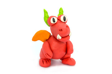 Play plasticine Dragon on white background. Handmade clay plasticine