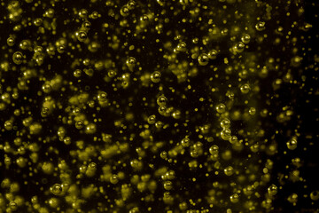 Randomly scattered air bubbles close-up, macro. Silvery metallic balls of mercury