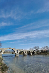 arta city old arched bridge of stones  through arahthos river greece