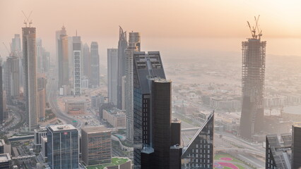 Fototapeta na wymiar Downtown skyline with modern architecture form above timelapse. Aerial view of Dubai business bay towers.