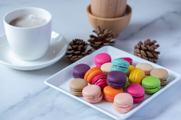 colorful macarons in white plate