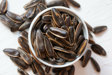 Sunflower seeds toasted in a blue bucket