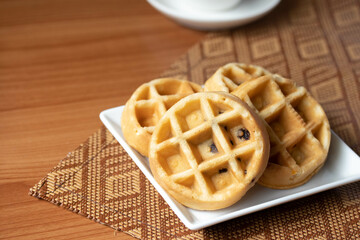 Breakfast vanilla waffles on a tray
