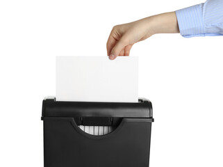 Woman destroying sheet of paper with shredder on white background, closeup