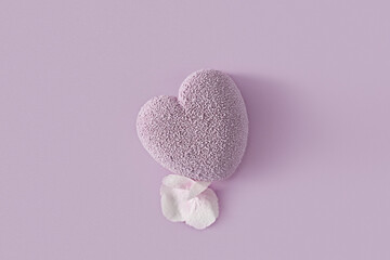 Mousse lavender heart-shaped cake on a purple background