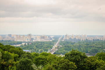 Kyiv, Ukraine. July 19. 2014. Cityscape of Kyiv, view of the left bank, Brovarsky prospect and the Metro bridge across the Dnieper river