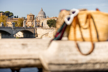 Landscape of Tiber river at sunny morning in Rome. Dome of famous saint Peter basalica on the...