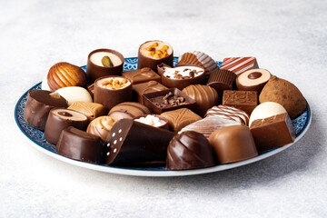 Various chocolate praline candies assortment close up