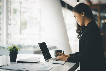 Beautiful Asian woman is a businesswoman who leads a new generation of startups, a woman who runs and manages a business plan to build confidence and stability in business, woman-led business concept.