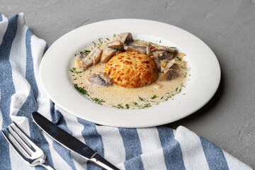 Delicious veal cutlet with melted mozzarella cheese on white plate