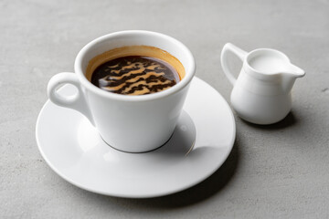 Cup of coffee drink on gray background close up