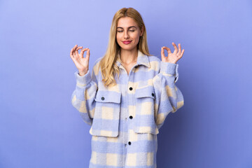 Young Uruguayan blonde woman over isolated background in zen pose