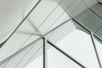 Geometric colored building facade elements with planes, lines and corners with light flare and...
