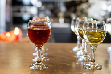 Glasses with white wine on blurred background