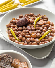 Beans recipe with chillies, black pudding and chorizo