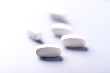 Lysine tablets. Concept for a healthy dietary supplementation. Nervous System Support. Soft focus. Bright background. Close up. Copy space.