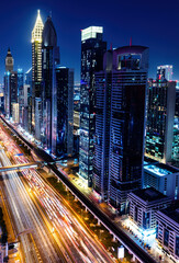 Obraz premium Skyscrapers highrise business buildings in downtown Dubai at night