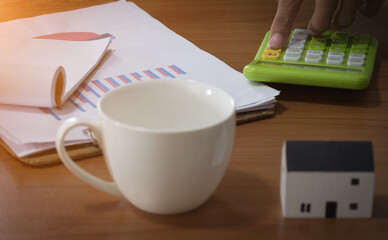 Hand of business man checking work on table,selective focus.