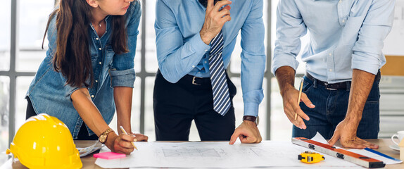 Professional of team architect industrial engineer cargo foreman in helmet working new construction...