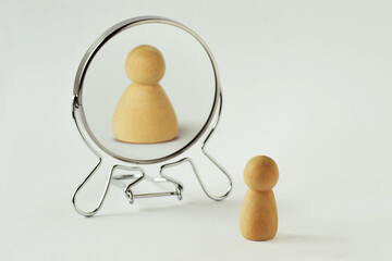 Small pawn looking in the mirror and seeing itself fat - Concept of dysmorphobia, anorexia,...
