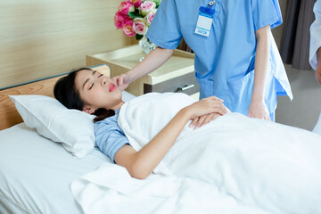 young woman patient lying on hospital bed. doctor visit and touch patient to examining symptom illness.