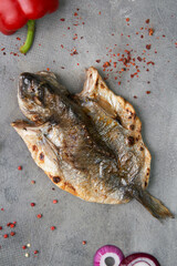 Baked dorado with vegetables