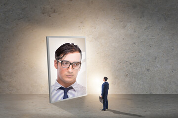 Young businessman in alter ego concept