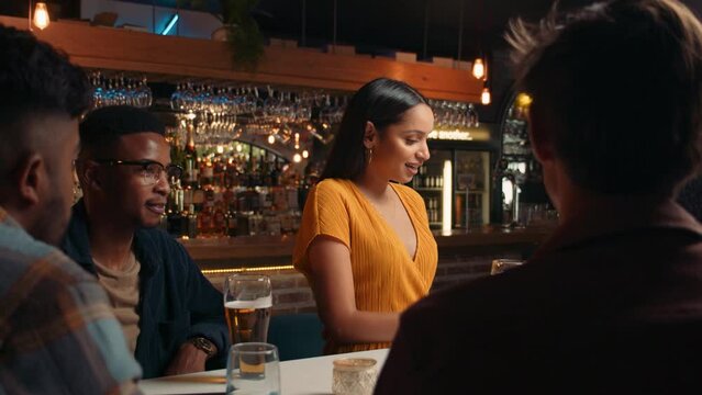 Diverse group of friends making a toast while out for drinks