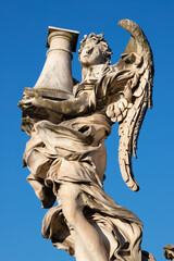 ROME, ITALY - SEPTEMBER 1, 2021: The Angel with the column on the Ponte Sant'Angelo by Antonio...