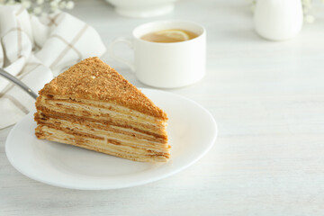 Concept of tasty food with honey cake, space for text