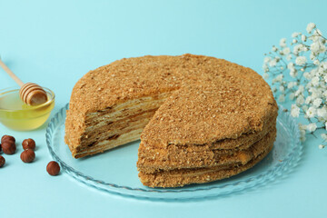 Concept of tasty dessert with honey cake, close up