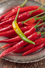 Red hot chili peppers on wooden background