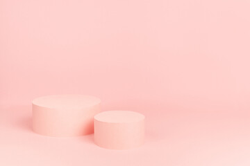 Romantic pastel pink stage with round two podiums mockup for presentation cosmetic product, goods, advertising, show on gentle soft light background, copy space.