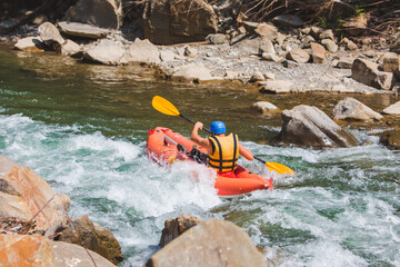 inflatable raft extreme sport at mountain river