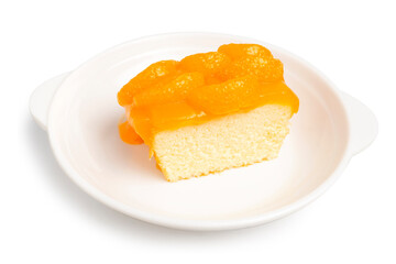 A Piece of Orange Sponge Cake topping with Sliced Orange, made from organic fresh orange juice, served on white plate isolated on white background. Clipping path