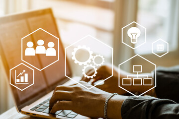 automation and workflow concept, businessman using laptop for working  and process workflow development on virtual screen.