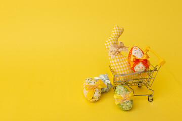 Minimalistic creative Easter concept on the yellow background. Happy Easter. Copy space