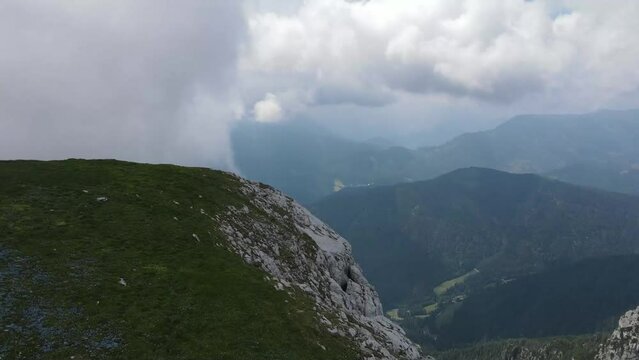 Above the clouds in the mountains drone shot.