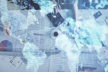 Double exposure of man and woman working together and financial theme hologram. international business concept. Computer background.