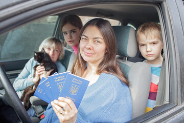 A family of Ukrainian refugees fleeing from the war against Russia, they cross the board by car...