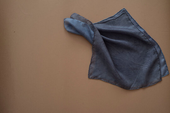 hand dyed clothes in blue tones on a bright background - text space -
slow fashion concept 