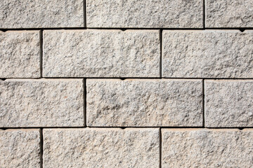 Facade finishing stone blocks. Gray brick background