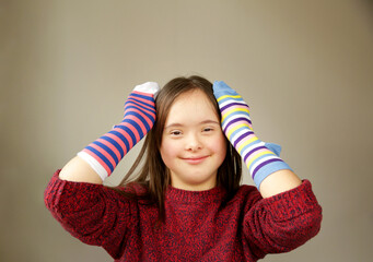 Beautiful girl smiling with different socks - 493937358