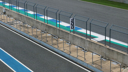 Asphalt racing track and shock fence.
