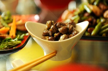 oriental food vietnamese hot salad chicken heart and lots of vegetables bright color serving Chinese and Japanese cuisine. High quality photo