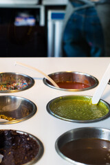 Display of  frozen yoghurt toppings at a market  
