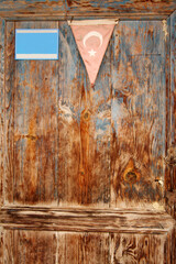 Turkish flag on an old wooden door